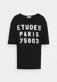 Black short-sleeve t-shirt made of cotton featuring large white text: "ÉTUDES PARIS 75003" on the front. Relaxed fit and crew neckline.