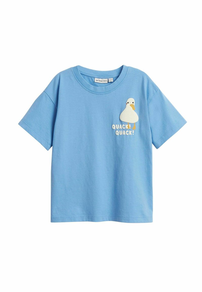 Vaaleansininen lyhythihainen t-paita, joka on valmistettu puuvillasta. Siinä on valkoinen sarjakuvamainen ankka -grafiikka, jossa lukee "KVAACK! KVAACK!" keltaisilla ja oransseilla eri väreillä.