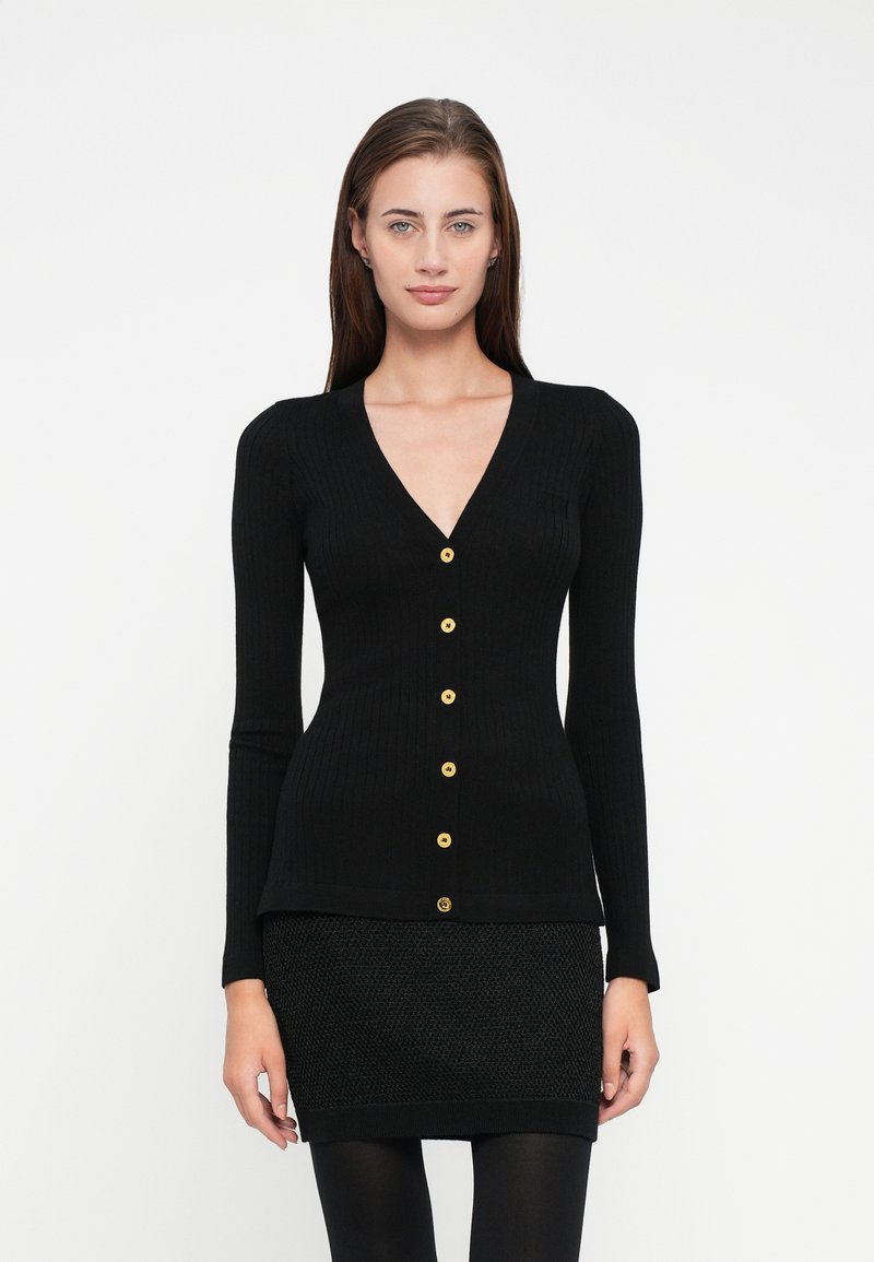 Black ribbed cardigan featuring a V-neck, long sleeves, and six gold buttons down the front. Stitched texture with a fitted silhouette.