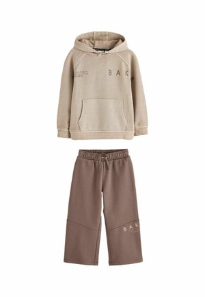 Beige hooded sweatshirt with front pocket and brown wide-leg pants with drawstring waist, both featuring partial "BAKER" text.