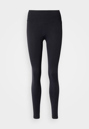 Colanți negri cu talie înaltă, cu bandă ribată, realizați dintr-un material elastic. Textură netedă, design strâns pe corp, fără modele sau accente vizibile.