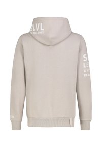 Hellbeige Kapuzenpullover aus weichem Stoff, mit einem großen weißen Logo auf der Kapuze und Text an den Ärmeln. Reguläre Passform mit gerippten Bündchen.