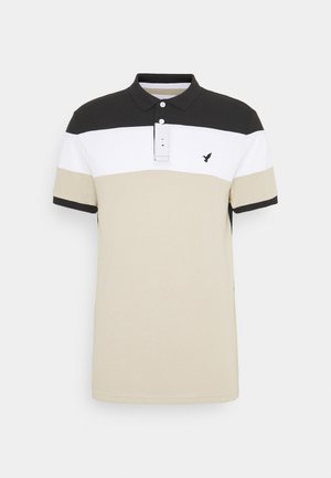 Heren polo met korte mouwen, voorzien van zwart, wit en beige horizontale strepen, een kraag en een klein logo-detail.