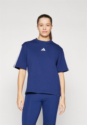 Navy blue cotton t-shirt with short sleeves, crew neckline, and white Adidas logo on the chest. Paired with matching navy leggings.