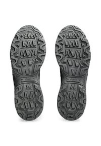 Sorte atletiske skosåler med tekstureret gummi, der har et zigzag-mønster og "ASICS"-logo, designet til greb og holdbarhed.