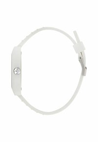 Valge silikoonkell, millel on ristkülikukujuline nägu ja hõbedane riistvara. Omab siledat tekstuuri ja reguleeritavat rihma, millel on sälguga detailid.