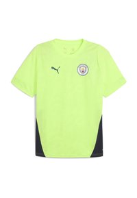 Kirkkaan keltavihreä Manchester City -jalkapallopaita, jossa on Puma-logo oikeassa rinnassa ja seuran vaakuna vasemmassa rinnassa, mustat sivupaneelit.