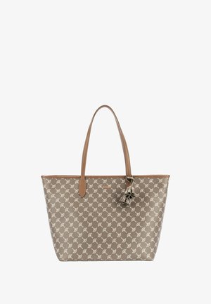 Sac cabas marron avec motif floral beige clair, deux longues anses en cuir et un pendentif fleur décoratif près de la base de l'anse.