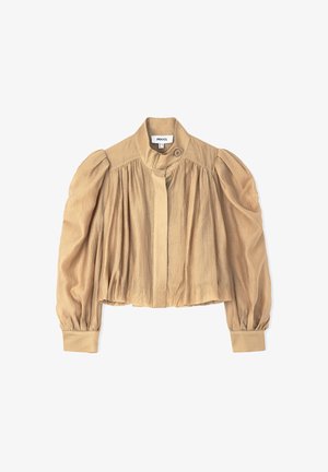 Korte beige jas met opbollende mouwen, sluiting met knopen aan de voorkant en een gestructureerde stof. Heeft een hoge hals en geplooide details.