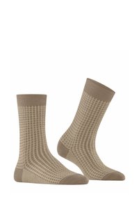 Beżowe skarpetki z wzorem kratki, zaprojektowane z prążkowanym mankietem i wzmocnionym palcem. Wykonane z miękkiego, oddychającego materiału.