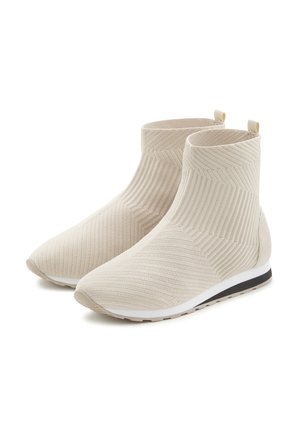 Knit ankle boots in pale beige with a textured design, featuring a light gray rubber sole and small back pull tabs for easy wear.