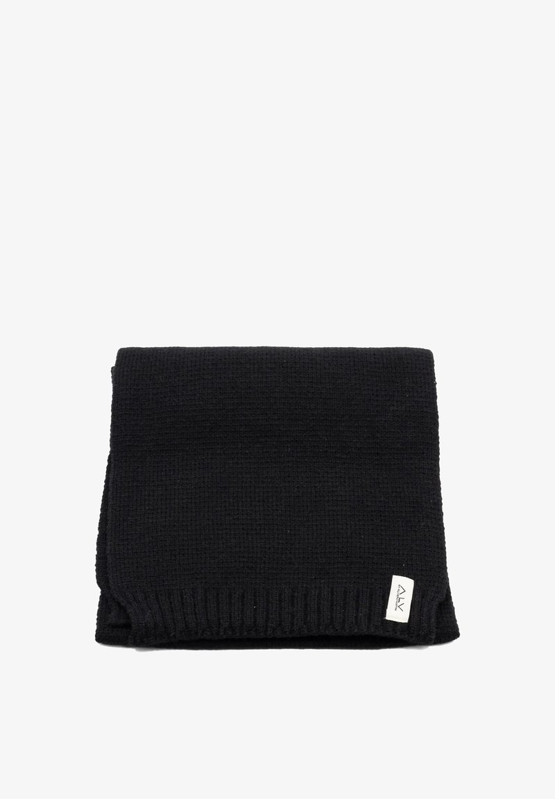 Sciarpa nera lavorata a maglia con tessuto testurizzato, bordi a coste e una piccola etichetta del marchio su un lato.