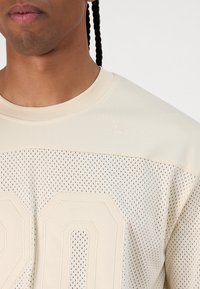 New Era Marškinėliai su spaudiniu - beige