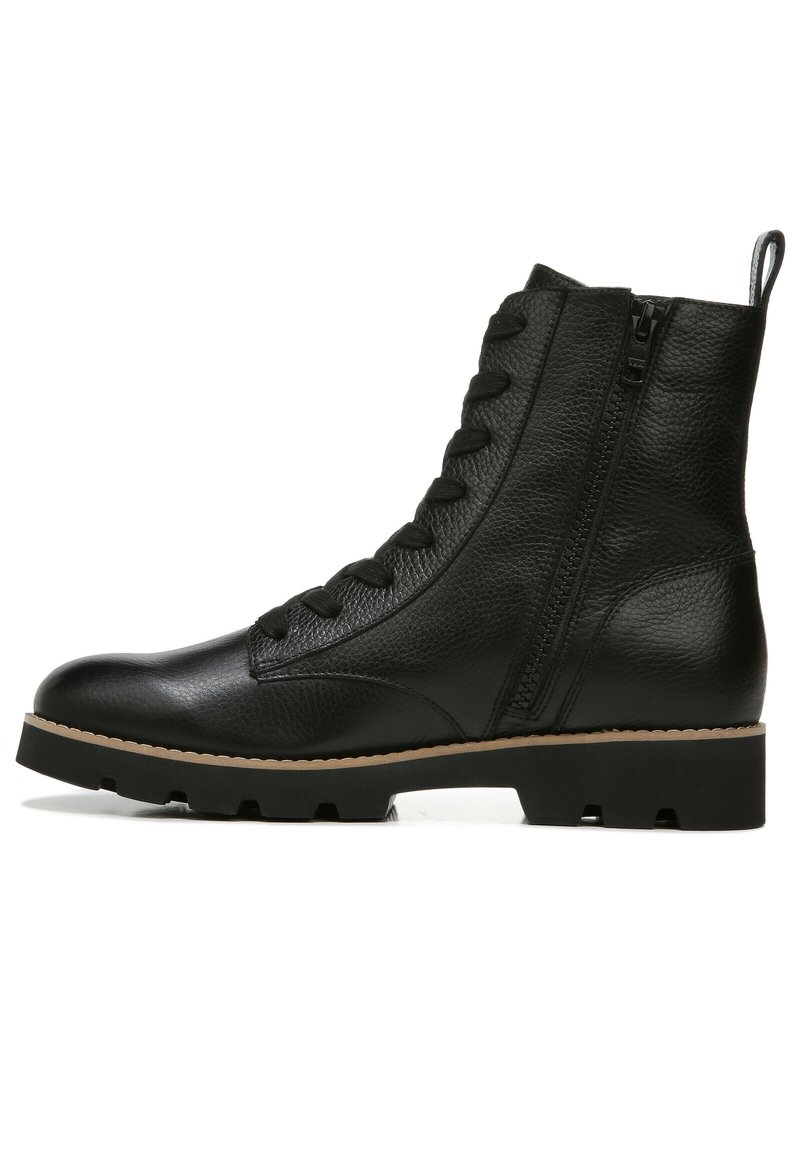 Black leather ankle boot with a textured finish, lace-up front, side zipper, and a rugged rubber sole for traction.