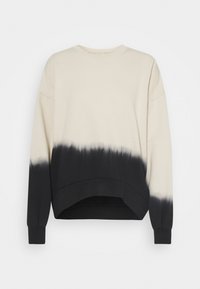 Pullover color beige chiaro con effetto dip-dye nero sulla parte inferiore. Presenta un collo rotondo, spalle scese e polsini a coste. Texture morbida.