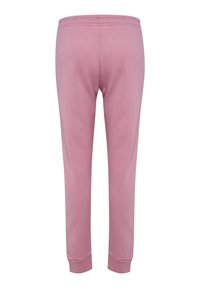 Roze joggingsbroek van zacht materiaal, met een elastische tailleband en ribgebreide manchetten. Het ontwerp is eenvoudig zonder extra patronen of accenten.