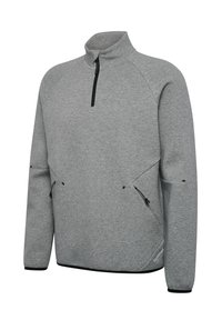 Lysegrå langærmet trøje med sort kvartlynlås, to sidelommer med lynlås, høj krave og diskret sort kant ved ærmekanter og nederst.