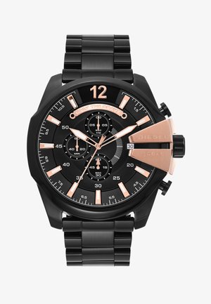 Orologio da polso Diesel in metallo nero con dettagli in oro rosa, quadranti cronografici, finestra data alle ore 3 e testo "ONLY THE BRAVE" sul quadrante.