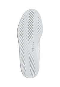 White athletic shoe sole with textured herringbone pattern and "adidas" branding. Smooth rubber material with raised sections for traction.