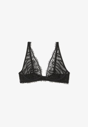 Bralette en dentelle noire avec une forme triangulaire, des bords festonnés et des motifs géométriques complexes sur tout le tissu. Sans rembourrage ni armature.