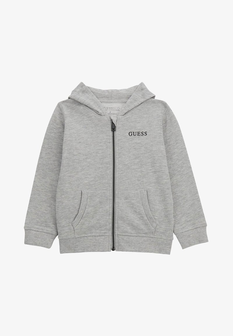 Graue Zip-Hoodie aus weichem Baumwollstoff, mit Kängurutasche, Kapuze mit Kordelzug und schwarzem "GUESS" Logo auf der Brust.