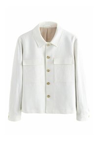 Giacca bianca realizzata in tessuto testurizzato, con colletto a punta, chiusura con bottoni e due tasche sul petto con pattina. I bottoni sono in legno chiaro.