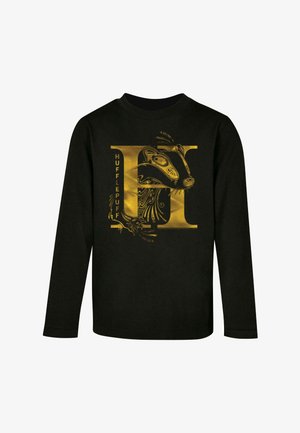 Fekete, hosszú ujjú póló, arany grafikával, amelyen egy borz és a "HUFFLEPUFF" felirat látható, bonyolult dizájnelemekkel integrálva a képi világba.
