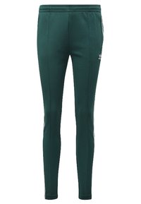 Zielone spodnie sportowe o gładkiej teksturze, elastycznym pasie i białych paskach po bokach. Posiadają małe logo na lewym biodrze z przodu.