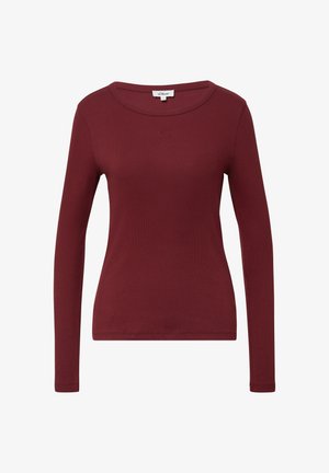 Chemise bordeaux à manches longues en tissu côtelé, avec un col rond et un petit logo brodé sur la poitrine. Texture lisse.