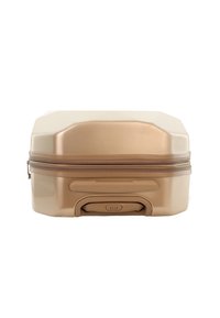 Gold hard-shell suitcase with a rectangular shape, textured finish, and a zippered closure. Features a pull handle and engraved branding.