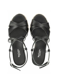 Sandalias de esparto negras con tiras entrecruzadas, suela texturizada y detalles en la correa del tobillo. Presenta una parte superior de cuero suave.