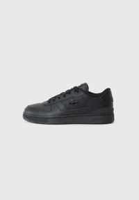Black leather sneaker with a low-top design, textured surfaces, lace-up closure, and a logo on the side. Features a rubber sole.