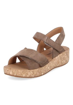 Brown leather wedge sandal with cork sole, adjustable ankle and front straps, open toe, and cushioned footbed.