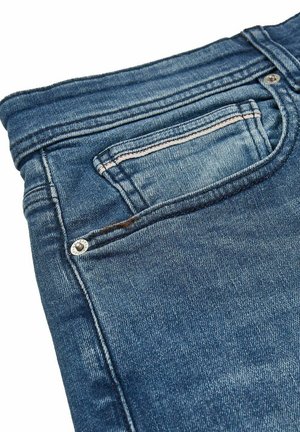Denim jeans with a faded blue color, featuring a back pocket with a stitched outline and silver hardware near the pocket opening.