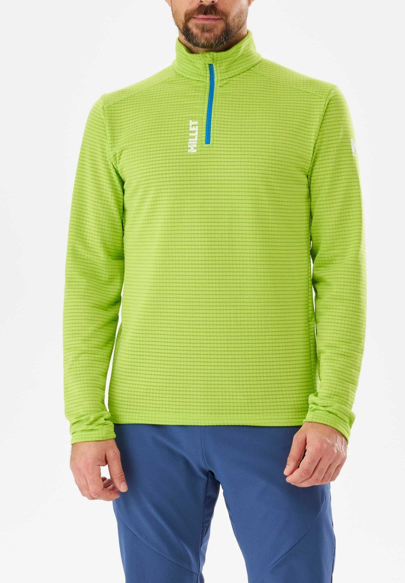 Pull polaire vert avec une fermeture éclair quart et une zipper bleue. Motif texturé sur l'ensemble. Manches longues et col haut.