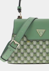 Green synthetic handbag with a structured design, featuring a geometric leaf pattern, adjustable strap, and gold-tone hardware.