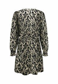 Robe noire et crème avec un motif de feuilles abstrait. Elle présente des manches longues et une taille ajustée, avec une texture de tissu douce.