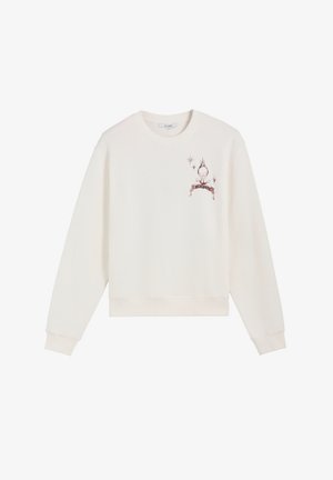 Biała bluza z długim rękawem, okrągłym dekoltem, z małą czerwono-czarną grafiką czaszki i płomienia oraz napisem na górnej lewej stronie klatki piersiowej.