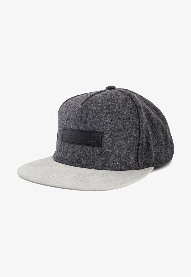Gray wool cap with a flat gray brim, featuring a black branded patch on the front and subtle stitching details. Textured fabric finish.