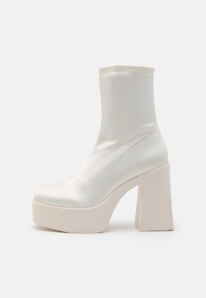 High heeled ankle boots - white