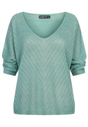 Jasnozielony sweter dzianinowy z szerokim dekoltem w kształcie litery V, wzorem w zygzaki i podwiniętymi rękawami. Wykonany z oddychającego materiału z detalami w otwartym ściegu.