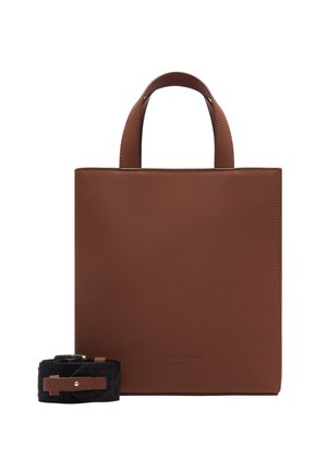 Brown leather tote bag with a minimalist square design, two top handles, and a detachable black strap featuring a buckle detail.