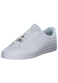 White sneakers with a smooth leather upper, padded collar, six-eyelet lace-up design, textured tongue, and flat rubber sole.