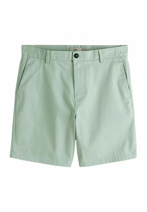 Hellgrüne knielange Shorts mit Gürtelschlaufen, Seitentaschen und einer Knopfleiste an der Taille.