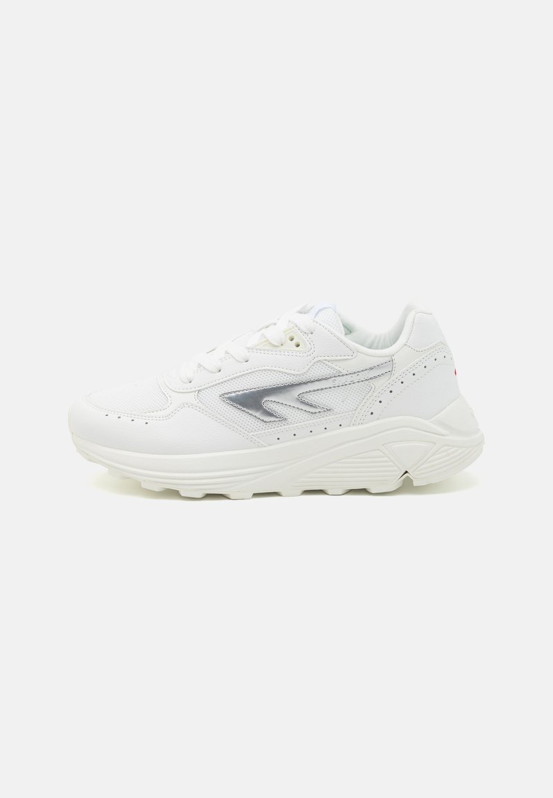White sneakers with a smooth leather upper, textured accents, a silver logo, and a thick rubber sole. Features lace-up closure and perforation details.