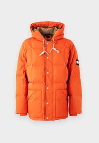 Orange puffer jacket with a hood, featuring a quilted design, snap buttons, two front pockets, and contrasting inner lining.