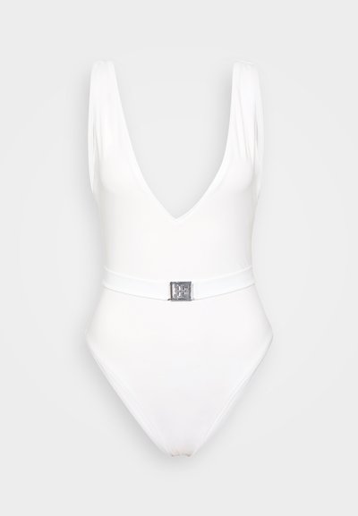 White one-piece swimsuit featuring a deep V-neck, wide shoulder straps, and a slim belt with a metallic buckle at the waist. Smooth texture.