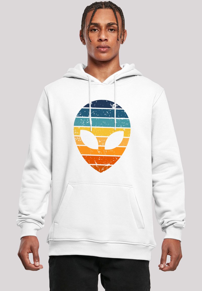 White hoodie featuring a large, distressed alien graphic in gradient stripes of blue, teal, orange, and yellow, with a front pocket.