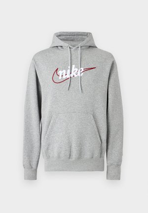 Felpa con cappuccio grigia realizzata in tessuto morbido, con un grande logo "nike" bianco e uno swoosh rosso. Include una tasca anteriore e coulisse sul cappuccio.