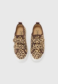 Leopard print sneakers with brown accents, featuring two hook-and-loop straps, white rubber sole, and a soft fabric upper.
